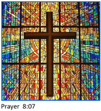 A stained glass window with a cross

Description automatically generated